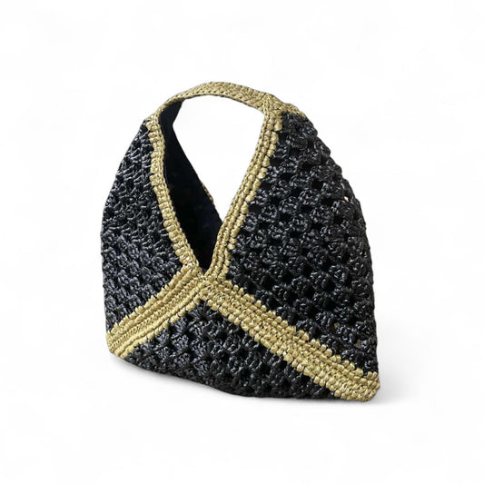 Black and gold woven handbag on a white background