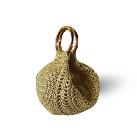 The Evita Moon Bag is a premium straw bag that is best styled as a handbag but also comes with a detachable strap so you can wear it as a shoulder bag too!
