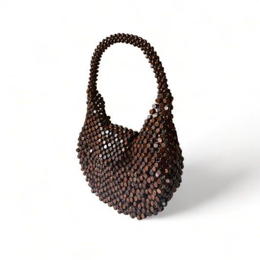 The Carmela handmade statement bag in Choco Brown color, made from wooden beads.