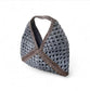 Crocheted bag with greyand brown pattern on a white background